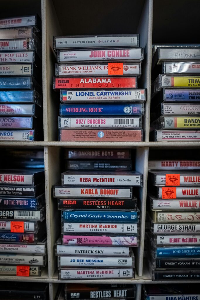 Cassette tapes lined in a large display case with multiple grids